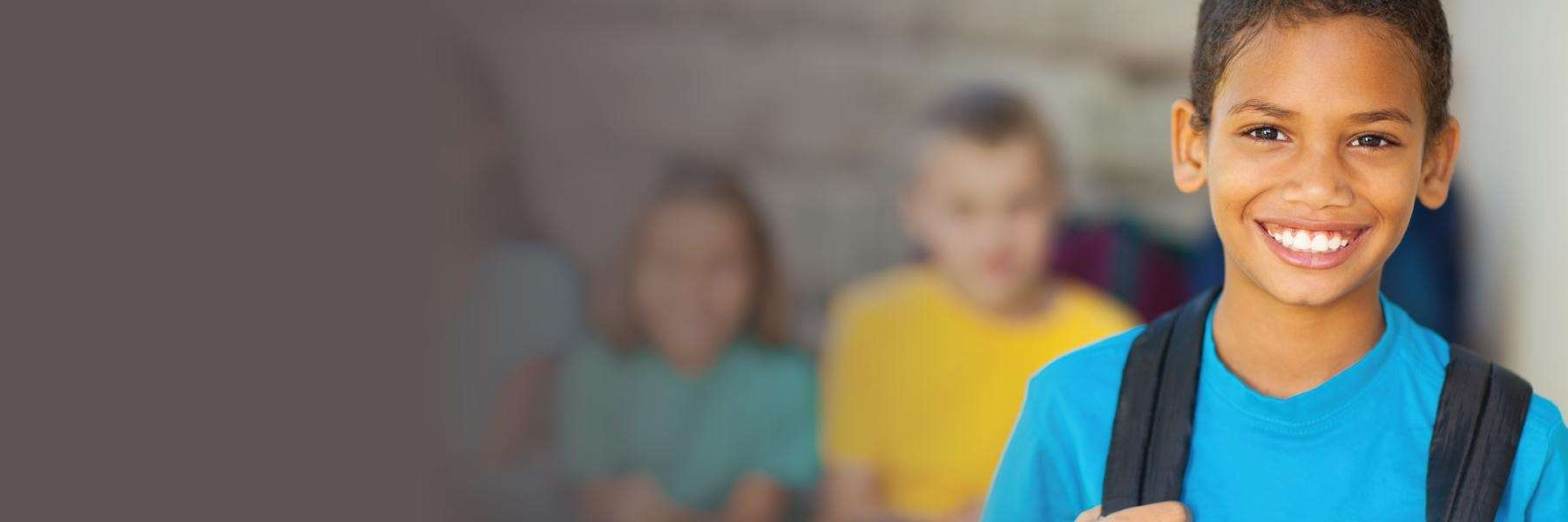 pediatric dentist highlands ranch | boy at school