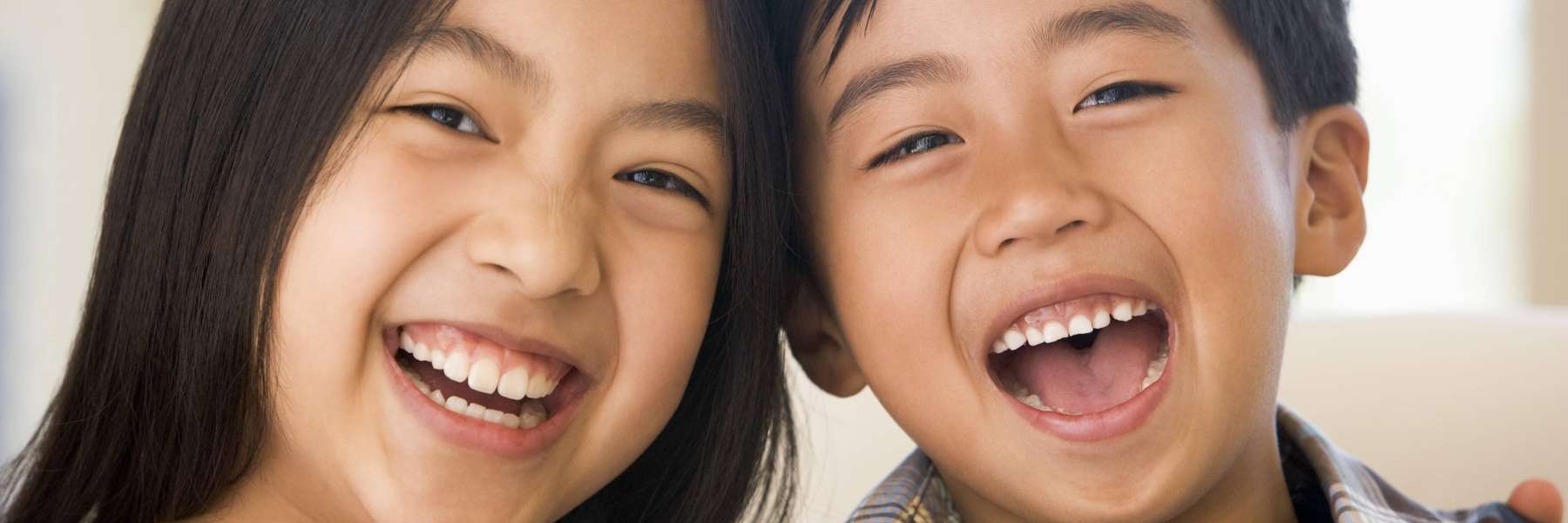 young boy and girl smiling after going to castle rock dentist