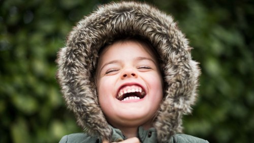 child laughing in castle pines, co