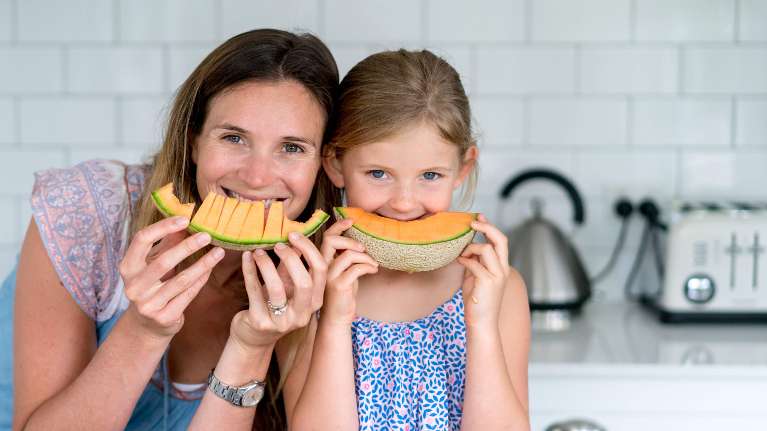 mother and daughter eating fruit | Castle Pines Children's Dentist