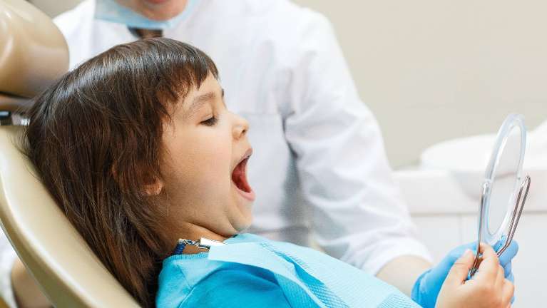 Young girl at dentist | Highlands Ranch Pediatric Dentist