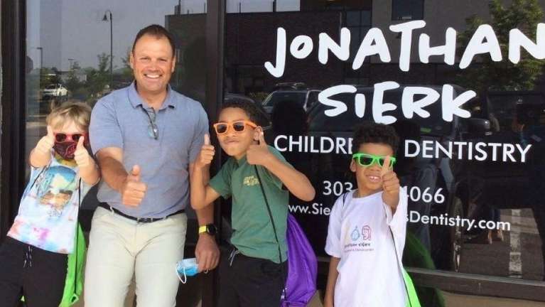 The best pediatric dentist, Dr. Jon Sierk, with happy patients.