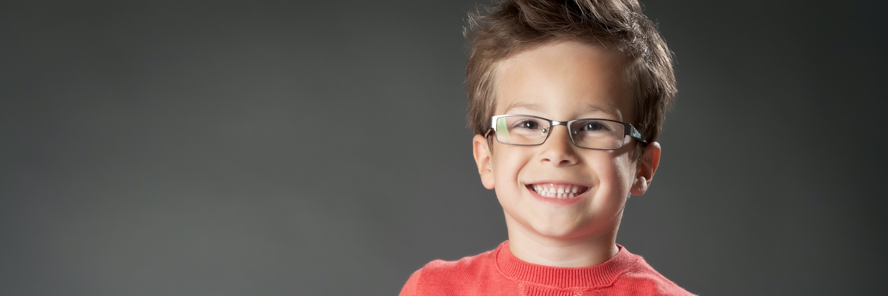 child smiling after getting pediatric dental fillings in castle pines