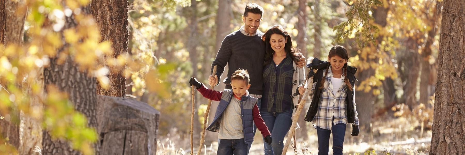 Tooth Extractions Castle Pines | family walking through woods