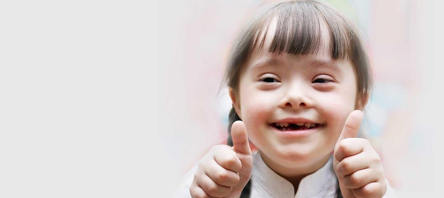 special needs dentistry | young girl giving a thumbs up in castle rock